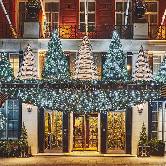 Lit up Christmas decorations outside Claridge's exterior
