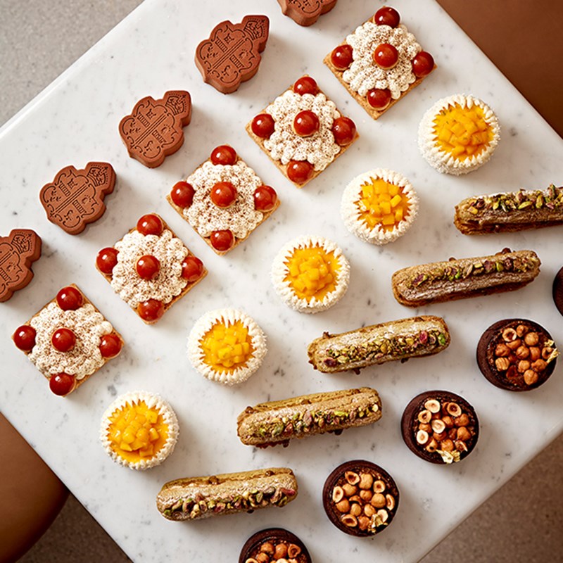 A selection of cakes of different sizes and shapes on a table