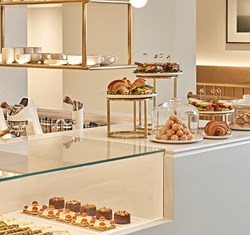 Claridge's Artspace Café counter with cakes and pastries on it.