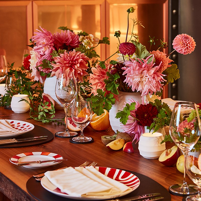 Flowers and tableware on a table at L'Epicerie at Claridge's