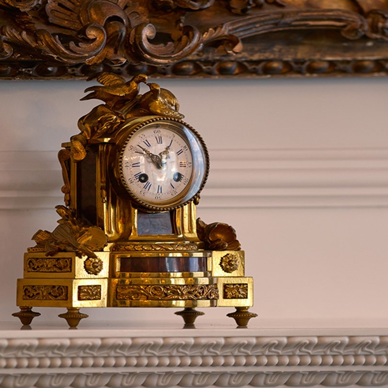 A beautiful clock on the fireplace in the Georgian Suite at Claridge's