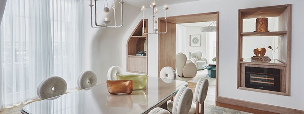 Dining room of suite with rounded dining chairs