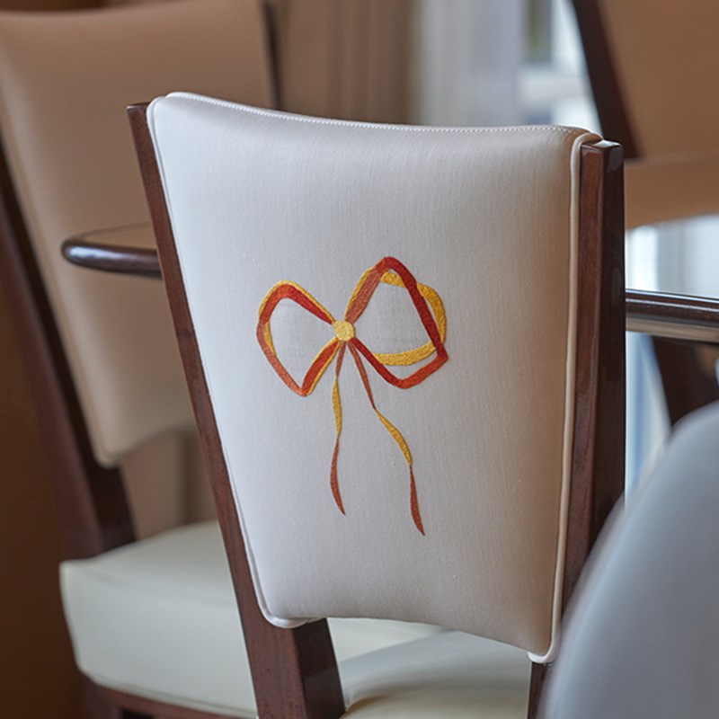 Mews Pavilion at Claridge's - back of a chair embroided.