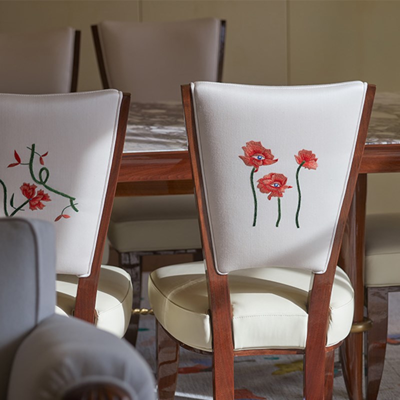 Embroided flower on the back of a chair