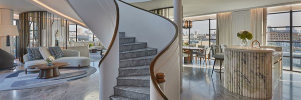 Spiral shaped staircase in the middle of a large suite