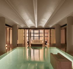 Pool and cabanas behind at Claridge's Spa