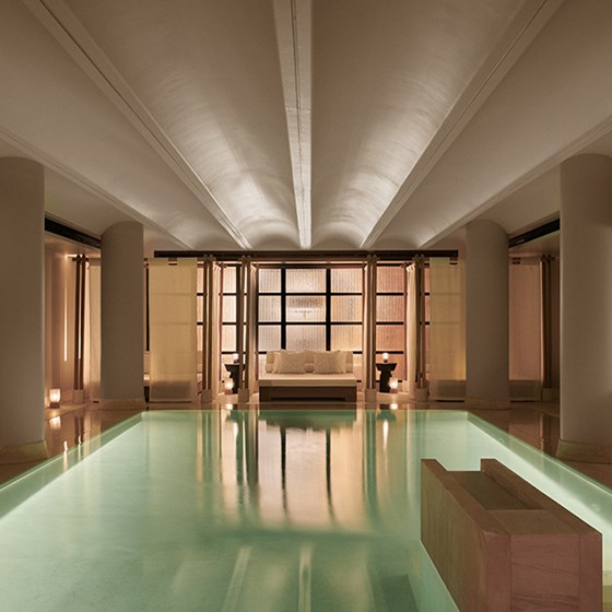 Pool and cabanas behind at Claridge's Spa