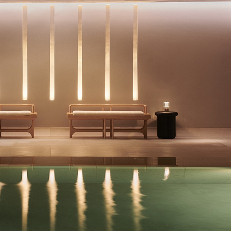 Pool at Claridge's Spa with sofa at the end of the pool.