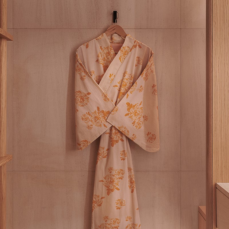 Claridge's Spa - bathrobe with pattern print on a hanger.